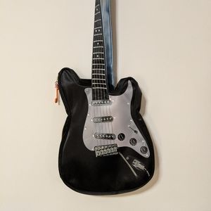Parcel guitar sling bag purse